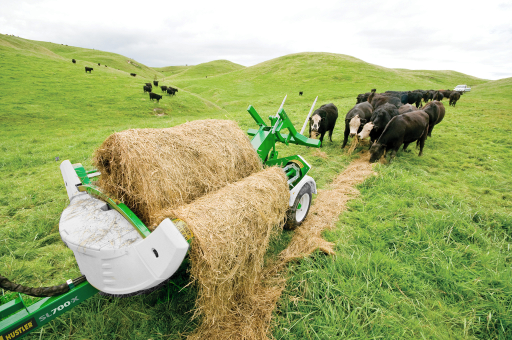 TX205 Trailed Chain Bale Unroller feeding out bales to cattle