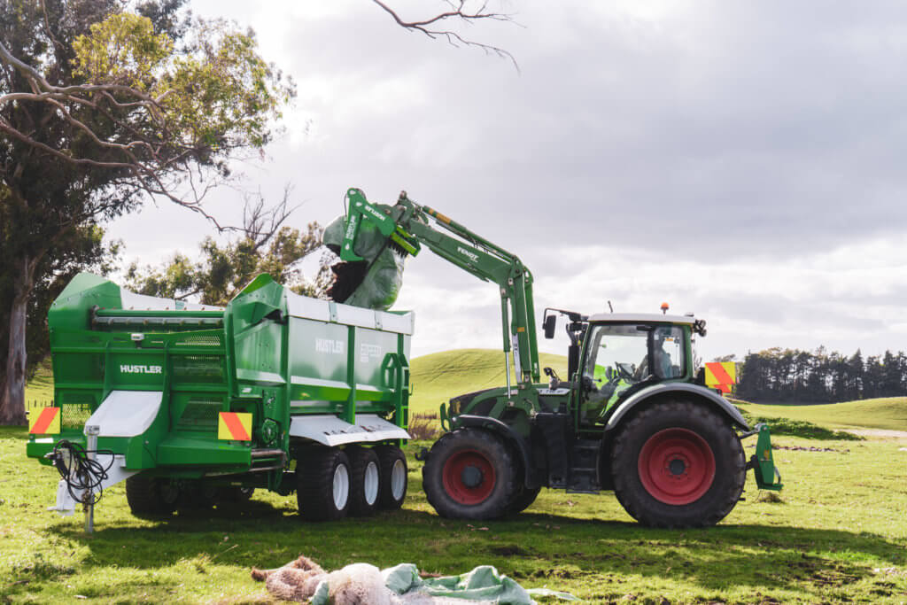 Hustler EZfeed silage wagon loading with baleslice